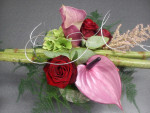 bloemstuk rood/roze tinten